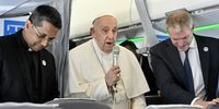 Pope Francis (C), next to Matteo Bruni (R), director of the Holy See Press Office of the Roman Curia, greets journalists during his flight from Rome, Italy to Marseille, France, 22 September 2023. The pontiff left Rome to make a two-day visit, marking his 44th Apostolic Journey abroad, to the southern French city of Marseille for the conclusion of the 'Mediterranean Meetings' (Rencontres Mediterraneennes), which gathered bishops and young people from across the Mediterranean.  EPA-EFE/ALESSANDRO DI MEO / POOL