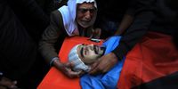 The grandfather of Muhammed Abu Awad (C) reacts during his funeral at Nur Shams refugee camp, in the West Bank city of Tulkarem, 19 January 2024. Muhammed Abu Awad was killed during the Isareli army operation in Tulkarem which has now entered its third day. Eight Palestinians were killed since Israeli forces stormed the city of Tulkarm and its camp on 17 January, according to the Palestinian Ministry of Health.  EPA-EFE/ALAA BADARNEH