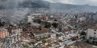 HATAY, TURKEY - FEBRUARY 07: Smoke billows from the scene of collapsed buildings on February 07, 2023 in Hatay, Turkey. A 7.8-magnitude earthquake hit near Gaziantep, Turkey, in the early hours of Monday, followed by another 7.5-magnitude tremor just after midday. The quakes caused widespread destruction in southern Turkey and northern Syria and were felt in nearby countries.  (Photo by Burak Kara/Getty Images)