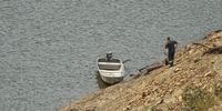 Divers prepare for a surveillance dive in the Kouga Dam to measure the depth of water. (Photo: Deon Ferreira)