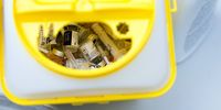 Discarded syringes and empty vials of the Covid-19 vaccine, produced by Pfizer Inc. and BioNTech SE, in a bin at the Cent Quatre cultural center in Paris, France, on Thursday, Jan. 28, 2021. The European Union remains at loggerheads with AstraZeneca Plc after the Anglo-Swedish drugmaker rejected demands that it take Covid-19 vaccine supplies from its U.K. factories to increase doses going to the bloc. Photographer: Nathan Laine/Bloomberg via Getty Images