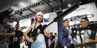 Visitors look at weapons at the Kalashnikov Group pavilion during the International Military-Technical Forum Army-2023 held at the Patriot Park in Kubinka, outside Moscow, Russia, 15 August 2023. The International Military-Technical Forum Army-2023 is held from 14 to 20 August 2023 at Patriot Expo, Kubinka Air Base and Alabino military training grounds.  EPA-EFE/YURI KOCHETKOV
