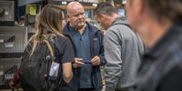 Wildlife inspector Harald Garretsen talks to a trader at AviMarkt, Netherlands, Europe’s largest bird fair. (Photo: Nathalie Bertrams)