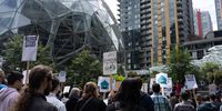 Amazon employees during a walkout outside the Amazon Spheres, part of the Amazon headquarters campus, in Seattle, Washington, US, on Wednesday, May 31, 2023. The Amazon.com Inc. employees are demanding more flexibility with remote work and more attention on Amazon's climate impact. Photographer: Chloe Collyer/Bloomberg via Getty Images