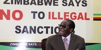 Former Zimbabwean president, the late Robert Mugabe, signs an anti-sanctions campaign in Harare in 2011. (Photo: Gallo Images)