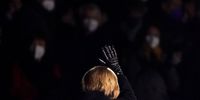 Outgoing German Chancellor Angela Merkel waves as she leaves the military tattoo ceremony hosted for her by the Bundeswehr on December 02, 2021 in Berlin, Germany. Merkel will be stepping down soon to make way for German Social Democrat (SPD) Olaf Scholz, who will lead a coalition government of SPD, Greens and German Free Democrats (FDP).(Photo by Clemens Bilan - Pool/Getty Images)