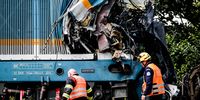 epa09394109 Rescuers at the scene of a train crash near the city of Domazlice, Czech Republic, 04 August 2021. According to state media citing firefighters, at least three people died and 38 were injured when a train coming from Munich and a local train collided.  EPA-EFE/MARTIN DIVISEK