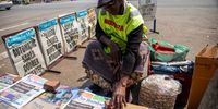 A street vendor sells daily newspapers featuring election result headlines in Harare, Zimbabwe, on Sunday, Aug. 27, 2023. Zimbabwean President Emmerson Mnangagwa was declared the winner of an election that observers said was deeply flawed, extending a tenure that has been marred by the near-collapse of government services and endemic poverty and unemployment. Photographer: Cynthia R Matonhodze/Bloomberg via Getty Images
