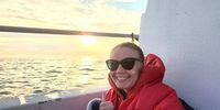 Michelle Weber takes in the sunset on the water. Image: Supplied