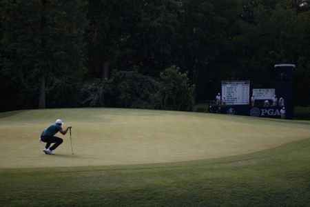 Koepka holds off Woods to win 100th PGA Championship