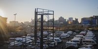 Taxis in a parking lot opposite the Bree Street Taxi Rank. Many taxi owners are struggling to meet their finance repayments. (Photo: Shiraaz Mohamed)
