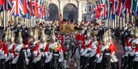 The State Carriage carrying Camilla, Queen Consort, King Charles III and South African President, Cyril Ramaphosa led by a mounted division of the Coldstream Guards makes its way along The Mall towards Buckingham Palace on 22 November 2022 in London, England. This is the first state visit hosted by the UK with King Charles III as monarch, and the first state visit here by a South African leader since 2010. (Photo: Carl Court - Pool / Getty Images)