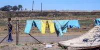 Overalls hang on a fence in Rietspruit, Mpumalanga.<br>(Photo: Tshepiso Mabula ka Ndongeni)