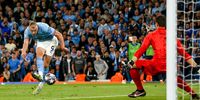 Erling Haaland of Manchester City (L) in action against goalkeeper Thibaut Courtois of Real Madrid (R) during the UEFA Champions League semi-finals, 2nd leg soccer match between Manchester City and Real Madrid in Manchester, Britain, 17 May 2023.  EPA-EFE/ADAM VAUGHAN