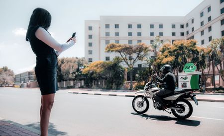 Delivery motorcyclists become mobile billboards to earn extra cash