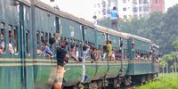 Bangladeshi homebound passengers onboard a crowded train at the Kamlapur train station to travel to their villages to celebrate the Eid-al-Adha festival in Dhaka, Bangladesh, 14 June 2024. Eid al-Adha is one of the two holiest Muslim holidays celebrated each year. It commemorates the yearly Muslim pilgrimage (Hajj) to Mecca, the most sacred place in Islam. During the holiday, Muslims slaughter sacrificial animals and divide the meat into three parts - one for the family, one for friends and relatives, and one for the poor and needy.  EPA-EFE/MONIRUL ALAM