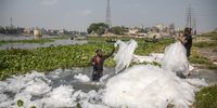 A man washes plastic sheets at the Buriganga river in Dhaka, Bangladesh, 05 June 2023. World Environment Day, a United Nations (UN) campaign to raise awareness about the protection of the environment, is celebrated annually on 05 June and this year's theme is 'solutions to plastic pollution'.  EPA-EFE/MONIRUL ALAM