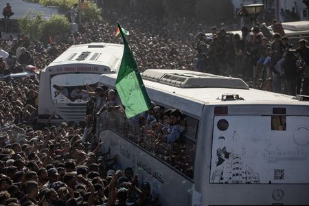 Hamas hands over hostage bodies after Israel threatens aid cut