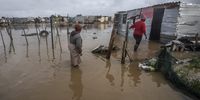 People fetching their belongings from their waterlogged homes at  COVID-19  a Informal Settlement in Bloekombos , Kraaifontein on July 01, 2021 in Cape Town, South Africa. It is reported that heavy rains and floods have battered some parts of the Western Cape and informal settlements in the area have been adversely impacted. (Photo by Gallo Images/Brenton Geach)