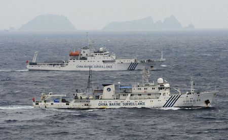 Japan shrine visits, isles row stir East Asia tensions