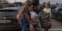 epa09924899 A man welcomes Anna and her son Svyatoslav who were evacuated from Mariupol at the evacuation point in Zaporizhzhia, Ukraine, 03 May 2022. Around 100 civilians were evacuated from the steel plant, the last Ukrainian-controlled area in the southern port city of Mariupol, according to Ukrainian officials. Thousands of people who were still in Mariupol and other areas in South Ukraine occupied by the Russian army waited to be evacuated to Ukraine's controlled area by buses and their own cars.  EPA-EFE/ROMAN PILIPEY