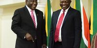 Cyril Ramaphosa, South Africa's president, left, and David Mabuza, South Africa's deputy president, attend a swearing-in ceremony in Pretoria, South Africa, on Thursday, May 30, 2019. Now that South Africa's cabinet has been announced, the rand may join its emerging-market peers in being whipsawed by a trade war that has subdued markets worldwide. Photographer: Waldo Swiegers/Bloomberg via Getty Images