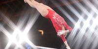epaselect epa09385288 Lu Yufei of China performs in the Women's Uneven Bars final during the Artistic Gymnastics events of the Tokyo 2020 Olympic Games at the Ariake Gymnastics Centre in Tokyo, Japan, 01 August 2021.  EPA-EFE/TATYANA ZENKOVICH