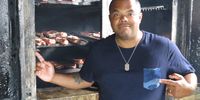 Here's Roger in front of a smoker that's loaded with pork ribs.  As seen on Season 8 of Cooking Channel's Man Fire Food.