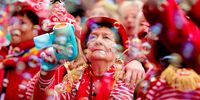 Costumed revelers celebrate the traditional 'Weiberfastnacht' (Women's Carnival Day or Fat Thursday) carnival in Cologne, Germany, 16 February 2023. The Thursday of the 'Old Wives' heralds the beginning of the street carnival.  EPA-EFE/FRIEDEMANN VOGEL