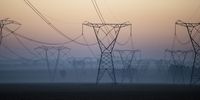 epa07800621 Power lines run from one of Eskom's coal fired power stations near Villiers, South Africa, 29 August 2019. The national power supplier is considering selling coal power stations to help settle Eskom's massive debt-burden.<br>In a document released by Treasury the government should sell Eskom's coal-fired power stations, possibly through a series of auctions, which could earn the state 450 billions Rands (about 27 billion euros). The national power grid has been under pereasure over the past decade resulting in high prices for power and power outages.  EPA-EFE/KIM LUDBROOK