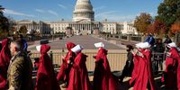 epa12505304 People wearing costumes from the TV series 'The Handmaids Tale' participate in a protest in front of the US Capitol in Washington DC, USA, 05 November 2025. The US Supreme Court held an expedited hearing on 05 November in Learning Resources, Inc. v. Trump, a case challenging President Donald Trump’s authority to impose tariffs on nearly all goods imported into the United States.  EPA/AARON SCHWARTZ