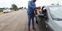 Chairman Atchar Irvin Mashele does his thing on the streets of Soshanguve in Pretoria. He says his smart style of dressing is why his business is flourishing. Photo: Elizabeth Sejake