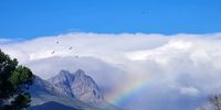 Walter Boekkooi<br>Clouds and rainbows blending in the winelands.<br>Stellenbosch