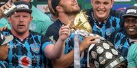 Duane Vermeulen (centre) of the Vodacom Bulls and his team mates celebrate after winning the Carling Currie Cup final between Vodacom Bulls and Cell C Sharks at Loftus Versfeld. (Photo: Christiaan Kotze / Gallo Images)