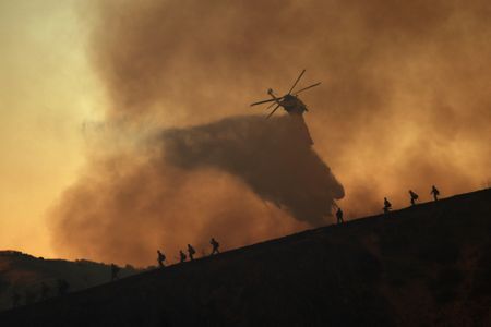 Los Angeles wildfires devour more homes even as fierce winds start to ease