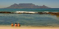 A HOT day in Cape Town today! Three ladies cooling off in the sea at Bloubergstrand. Photographer: Martin Fennell