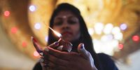 A Malaysian Hindu devotee holds an oil lamp during the Diwali Hindu festival at a Hindu temple in Shah Alam, ouside Kuala Lumpur, Malaysia, 04 November 2021. Deepavali, or Diwali, is known as the festival of lights and celebrated by Hindus, Sikhs, and Jains globally and commemorates the triumph of good over evil.  EPA-EFE/FAZRY ISMAIL