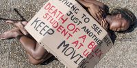 An activist demonstrates during the University of Cape Town (UCT) students meeting on November 01, 2017 in Cape Town, South Africa. More than 1 000 students gathered at the Jameson Plaza to discuss issues of free education. (Photo by Gallo Images / Netwerk24 / Jaco Marais)
