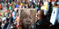 JOHANNESBURG, SOUTH AFRICA - DECEMBER 10:  Members of the public sing and dance inside the FNB Stadium, on December 10, 2013 in Johannesburg, South Africa. Over 60 heads of state have travelled to South Africa to attend a week of events commemorating the life of former South African President Nelson Mandela. Mr Mandela passed away on the evening of December 5, 2013 at his home in Houghton at the age of 95. Mandela became South Africa's first black president in 1994 after spending 27 years in jail for his activism against apartheid in a racially-divided South Africa  (Photo by Jeff J Mitchell/Getty Images)