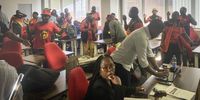 SAMWU members sing and dance at the end of the media briefing. (Photo: Michael Barthelemy)