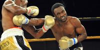 Lovemore N'dou (R) hits Bongani Mwelase during the IBO Welterweight title fight at Emperor's Palace on September 18, 2010 in Kempton Park, South Africa.  (Photo by Duif du Toit/Gallo Images/Getty Images)