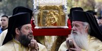 Romanian Orthodox priests carry the relics of Saint Dimitrie Basarabov (Saint Demetrius the New), the patron saint of Romania's capital, during a procession around Patriarchal Cathedral in Bucharest, Romania, 24 October 2024. Romanians will celebrate Saint Dimitrie Basarabov on 27 October, with thousands of pilgrims from all over the country expected in Bucharest to worship the relics of the patron Saint of Bucharest.  EPA-EFE/ROBERT GHEMENT