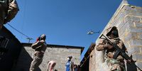 A police helicopter hovers over the township of Alexandra while army personnel and police confiscate stolen goods after  looting and vandalism in parts of Johannesburg. (Photo: Felix Dlangamandla / Daily Maverick)