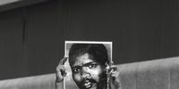A protester holds a poster of Steve Biko during a demonstration during the Truth and Reconciliation hearings in East London in 1996. (Photo: Oryx Media Archive / Gallo Images)