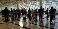 Passengers wait to board an Ethiopian Airlines flight to Cape Town on 4 February 2022 at Bole International Airport in Addis Ababa, Ethiopia. (Photo: David Silverman / Getty Images)
