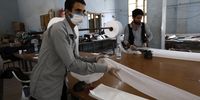 Workers produce face masks amid concerns over the coronavirus pandemic at a workshop in Sanaa, Yemen, 13 April 2020. (Credit: EPA-EFE/Yahya Arhab)<br>