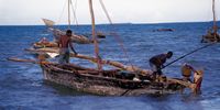 Everyday life at Bagamoyo, Tanzania... with Stone Town, Zanzibar on the horizon. Photographer: Peter Chubb