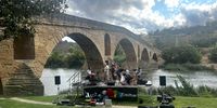 A jazz band playing at a music festival on the banks of the Arga river at Puente la Reina. The seven arch bridge in the background, Spain, 26 August 2023. (Photo: Pauli van Wyk)