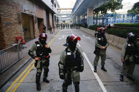 Hong Kong police to enter university as hunt for protesters turns up empty