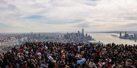 NEW YORK, NEW YORK - APRIL 08: People watch a partial solar eclipse on the observation deck of Edge at Hudson Yards on April 08, 2024 in New York City. While New York City isn't in the path of totality, it will see up to 90% of the sun covered by the moon. Around New York and in the path of totality, millions of residents and tourists are preparing for a total solar eclipse. (Photo by Spencer Platt/Getty Images)